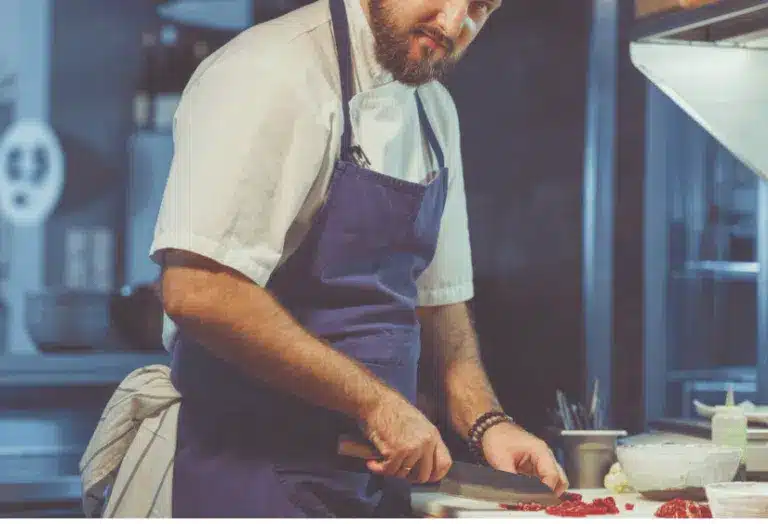 Chef at work in professional kitchen - cooking oil industry news and insights