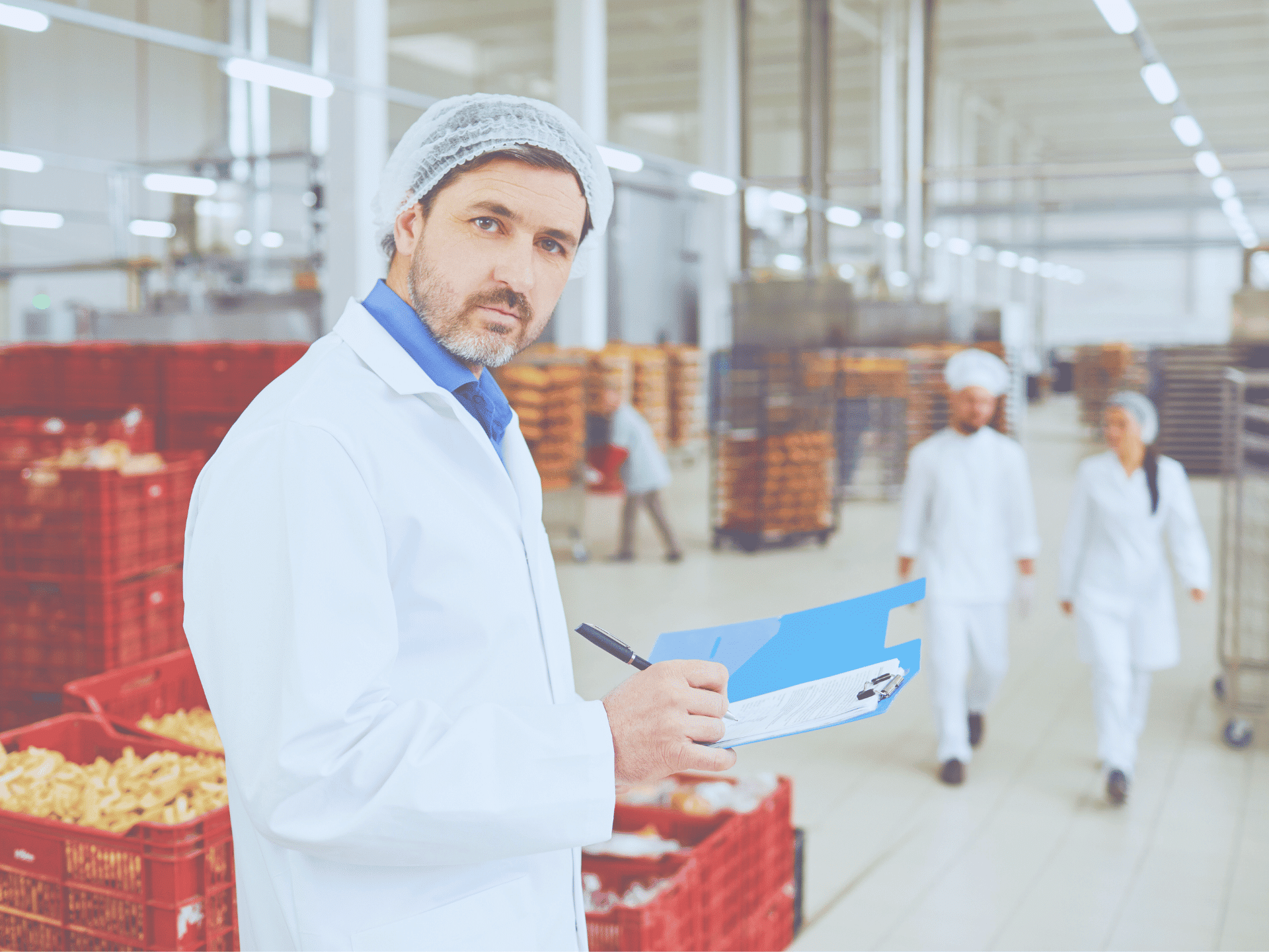 Food manufacturing facility worker inspecting quality - industrial cooking oil collection